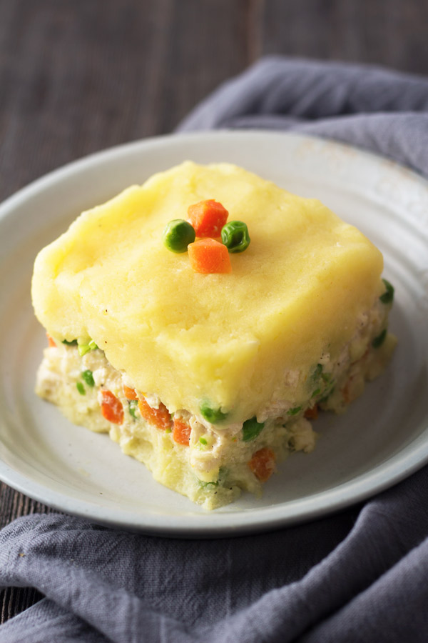 Peruvian Causa Rellena is a layered potato dish, made with potatoes and chicken salad. It is so tasty bursting with delightful flavors. | www.butterandthings.com