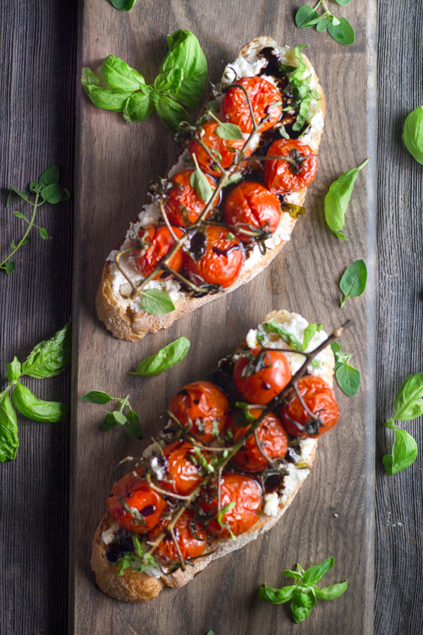 Vined Roasted Tomatoes - are roasted slowly with garlic, avocado oil, and basil. Served on top of toast, roasted garlic basil ricotta spread, and drizzled with balsamic glazed, it is too die for. | www.butterandthings.com